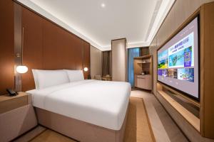 TV a/nebo společenská místnost v ubytování Jingdong Headquarters Crystal Orange Hotel, Yizhuang, Beijing