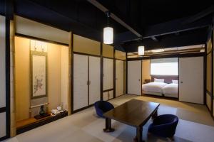 a room with a table and chairs and a bed at Koyado Enn in Toyooka +96 photos