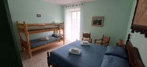 Ένα ή περισσότερα κρεβάτια σε δωμάτιο στο La cuccia del sole +51 φωτογραφίες