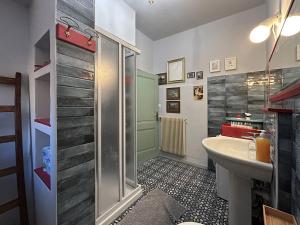 a bathroom with a shower and a sink and a toilet at Villa della Comare in Osigo +40 photos