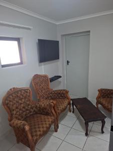 TV a/nebo společenská místnost v ubytování Grace Villas 1