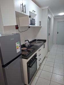 Kuchyň nebo kuchyňský kout v ubytování Grace Villas 1