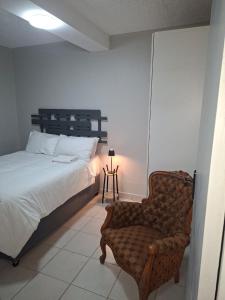 Postel nebo postele na pokoji v ubytování Grace Villas 1