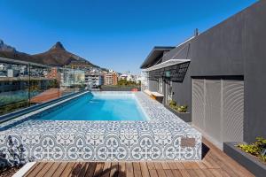 a swimming pool on the roof of a house at SIX ON N - Fluent Serviced Apartments in Cape Town