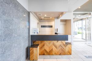 a kitchen with a counter with wood at Hotel Elite Kyoto Station in Kyoto +27 photos