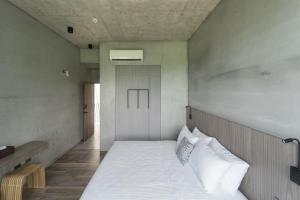 Ένα ή περισσότερα κρεβάτια σε δωμάτιο στο Mr-M都蘭