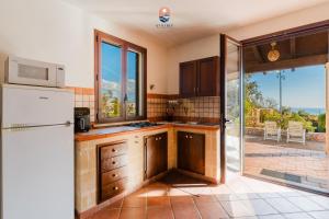 Kuchyň nebo kuchyňský kout v ubytování Villa Dolce Vita by Vivimy + 34 fotografií