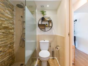 a bathroom with a toilet and a shower at Blue Horizon Retreat in Playa del Aguila +34 photos