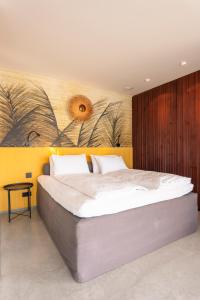 Ένα ή περισσότερα κρεβάτια σε δωμάτιο στο ORANGE LOUNGE Attersee