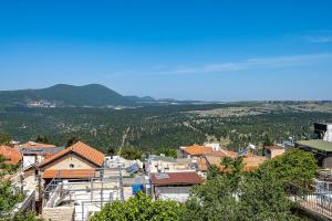 a view of a town with mountains in the background at Moses Luxury apartment 38 jerusalem in Safed