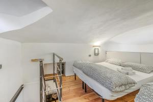 En eller flere senge i et værelse på Le Bon Bon Rose - Happy Rentals