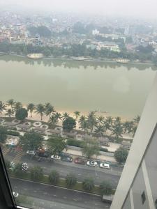 arial view of a river with cars parked next to a road at Gia An Homestay in Phú Thú