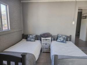 Postel nebo postele na pokoji v ubytování CLR Accommodation