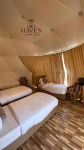 Ένα ή περισσότερα κρεβάτια σε δωμάτιο στο Haven Luxury Camp