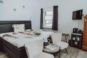 Ένα ή περισσότερα κρεβάτια σε δωμάτιο στο Bed & Breakfast Het Vinkenest Nijverdal