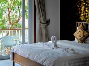 Giường trong phòng chung tại White Beach Resort Longset