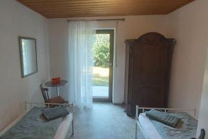 En eller flere senge i et værelse på Ferienhaus in Langenloh bei Nürnberg
