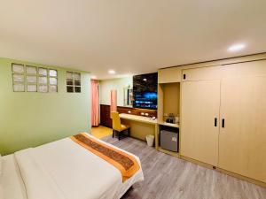 a bedroom with a bed and a desk in it at Baan Chanchay Hua Hin in Hua Hin +32 photos