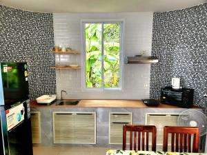 Nhà bếp/bếp nhỏ tại Phing Villa