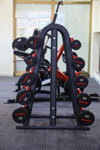 a gym with a bunch of bikes on a rack at My Dream Apartments - 4 miles from Bole International Airport in Addis Ababa