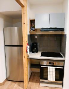 Kuchyň nebo kuchyňský kout v ubytování T4 en duplex, résidence atypique en pleine forêt + 24 fotografií