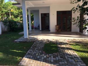 a front porch of a house with a door at Bosadi holiday home katunayaka in Katunayake