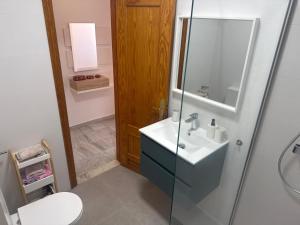 a bathroom with a sink and a shower at apartamento Cabo de Gata in El Cabo de Gata +5 photos