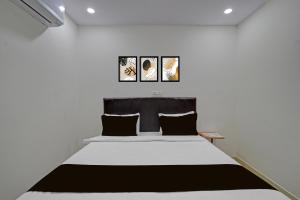 Ένα ή περισσότερα κρεβάτια σε δωμάτιο στο Hotel O Square Mall Hyderabad Formerly A1 Classic +60 φωτογραφίες