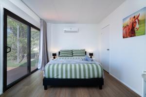 Ένα ή περισσότερα κρεβάτια σε δωμάτιο στο 3BR Cozy Sunnybank Hills Home