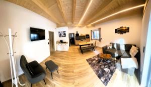 a living room with a couch and a table at LechHuamat in Weissenbach am Lech