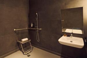 a bathroom with a sink and a shower and a mirror at ibis Madrid Norte Las Tablas in Madrid +20 photos