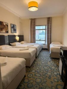 Postel nebo postele na pokoji v ubytování Saif Al Majd Hotel