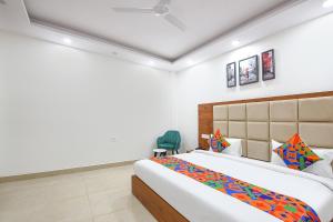 Postel nebo postele na pokoji v ubytování FabHotel Evergreen