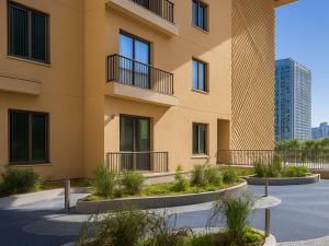 a building with some plants in front of it at Marriott Vacation Club, Waikīkī- 1 BEDROOM in Honolulu +5 photos