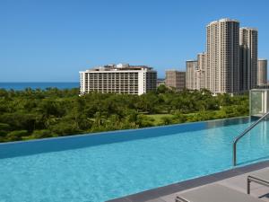 a swimming pool with a view of the city at Marriott Vacation Club, Waikīkī- 1 BEDROOM in Honolulu