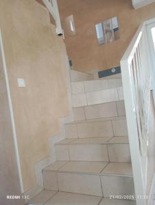 a staircase in a house with a stair case at Belle Maison-St Exupéry- Groupama stadium-Viarhona-T3 in Jons