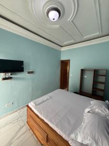 Una cama o camas en una habitación de Résidence akiba home plus 11 fotos más