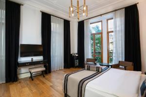 Ένα ή περισσότερα κρεβάτια σε δωμάτιο στο AKKA Lush Hotel Taksim