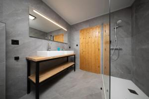 a bathroom with a sink and a shower at Appartements Sonnenstein Sölden, close to lift & centre in Sölden +20 photos
