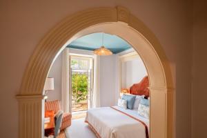 Ένα ή περισσότερα κρεβάτια σε δωμάτιο στο Pergola Boutique Hotel