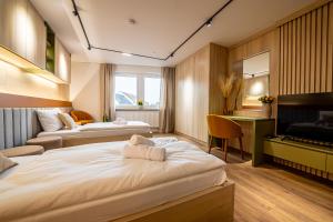 Postel nebo postele na pokoji v ubytování City-House-Achern Studios