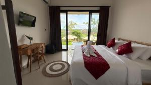 Postel nebo postele na pokoji v ubytování Umah 610