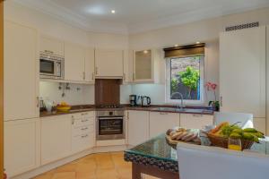 Kuchyň nebo kuchyňský kout v ubytování Palheiro Village Resort + 20 fotografií