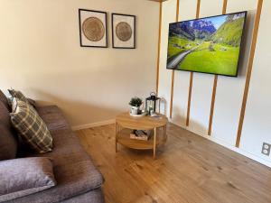 a living room with a couch and a table at River-2 with Iconic Jungfraujoch View in Interlaken