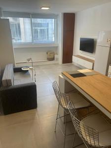 a kitchen with a table and chairs in a room at Espacio Centro in La Plata