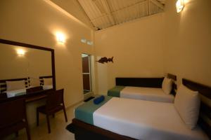 Giường trong phòng chung tại Nugasewana Resort