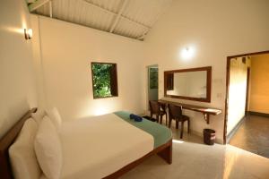 Giường trong phòng chung tại Nugasewana Resort