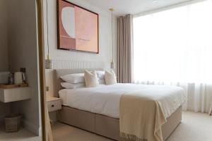 a bedroom with a bed and a large window at Rooms at 32 in Sligo +25 photos