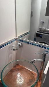 a sink in a kitchen with aaucet at Espacio Centro in La Plata