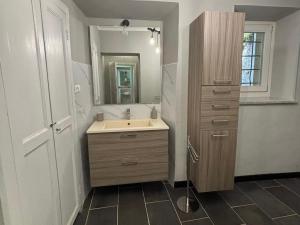 a bathroom with a sink and a mirror at La Quiete del Mattino in Torre Pellice +15 photos